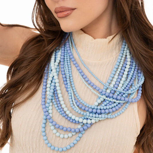 Collana multi linee con sfere in acrilico tono azzurro